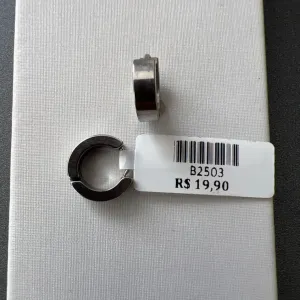 BRINCO MASC ARGOLA AÇO QUAD